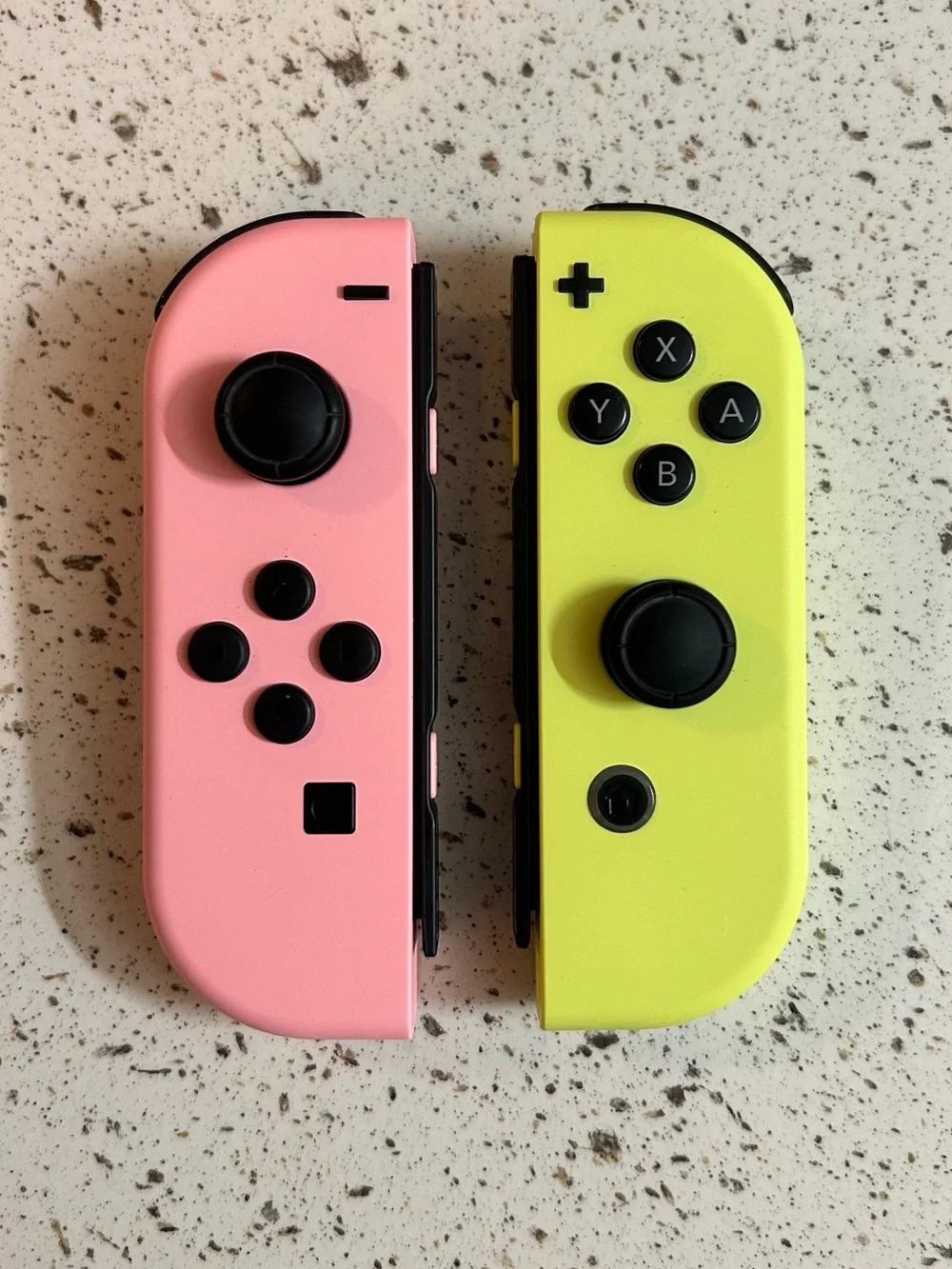 Nintendo Switch with Pastel Pink and Yellow Joycons + Accessories (Preowned)